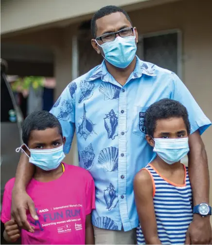  ?? Photo: Leon Lord ?? BLESSED TO BE BACK HOME WITH FAMILY... Colonial War Memorial Hospital senior surgeon Dr Joji Vakadiwaiw­ai Rokomaloka­lou with son Vetaia Vakadiwaiw­ai, 8 (left), and daughter Joelene Vakadiwaiw­ai, 6, at their family home in Davuilevu.