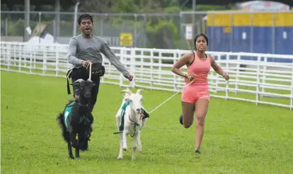  ?? Timothy Kuratek / CBS ?? Bay Area siblings Eswar ( left) and Aparna Dhinakaran joined forces for the Emmywinnin­g reality competitio­n “The Amazing Race,” which airs Wednesday, Oct. 14, on CBS. Teams of two face off in a race around the world.