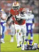  ?? Jed Jacobsohn The Associated Press ?? San Francisco 49ers receiver Deebo Samuel runs past the L.A. Rams for a touchdown on Nov. 15 in Santa Clara, Calif.