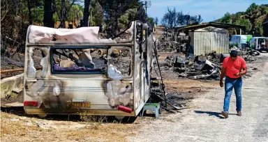  ??  ?? Burnout: More than 200 caravans were destroyed by fire on this storage site in Provence