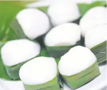  ??  ?? Tago, or coconut jelly wrapped in pandan cup.