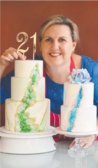  ?? Picture: GLENN HAMPSON ?? Cake maker Vanessa Killian with the latest trend in the game – geode cakes, which feature a cutout designed to look like a crystal geode.