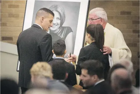  ?? DAX MELMER ?? Former Windsor mayor Eddie Francis attends the funeral for his wife, Michelle Prince, with the couple’s two children, Phoenix and Sienna, on Friday at Corpus Christi Church. Prince died Nov. 18 after a long and public battle with colon cancer.