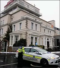  ??  ?? Police cordon: Officers at the Regency Hotel