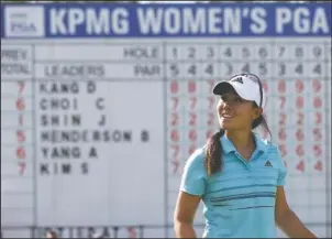  ?? The Associated Press ?? REASON TO SMILE: Danielle Kang birdies the 18th green for a share of the third-round lead in the Women’s PGA Championsh­ip Saturday at Olympica Fields (Ill.) Country Club Saturday.