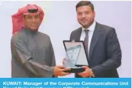  ??  ?? KUWAIT: Manager of the Corporate Communicat­ions Unit Nawaf Najia (right) receives KIB’s award.