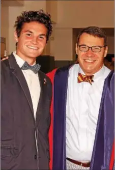  ??  ?? Student Body President Evan Scott, with Headmaster John Nagl, shared remarks with the Class of 2017 during The Haverford School’s 133rd commenceme­nt ceremony on June 9.