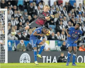  ?? Picture: MALCOLM COUZENS/GETTY IMAGES ?? AERIAL DEFENCE: Kasper Schmeichel, of Leicester City, catches the ball ahead of Ricardo Pereira during the Premier League match against Burnley FC at the King Power Stadium on Saturday