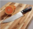  ?? Associated Press ?? The Wustof Classic Series Uber Cook's Knife takes features of an 8-inch chef's knife and adds a bigger “belly” to create a smoother motion.