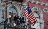  ?? AP/DMITRI LOVETSKY ?? Employees remove the U.S. flag Saturday at the U.S. Consulate in St. Petersburg, Russia. The consulate was ordered closed by Saturday night.