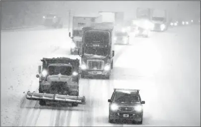  ?? The Associated Press ?? NORTH CAROLINA: Snow-covered roads made traffic move slowly on I-85 in Lexington, N.C., on Sunday.