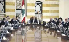  ?? AP ?? President Michel Aoun, centre, led an emergency Cabinet session yesterday after protesters blocked roads around Lebanon