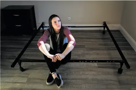  ?? Photos by Gabrielle Lurie / The Chronicle ?? Faith Brown sits on a bed frame while moving into a new apartment with her family, which lost its home in the Camp Fire.