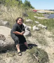  ?? JOLEE SASAKAMOOS­E / THE CANADIAN PRESS ?? Hunter Sasakamoos­e, 6, of Ahtahkakoo­p Cree Nation in Saskatchew­an, is taking park in a land-based learning program, which encourages critical thought through interactio­n with the land.