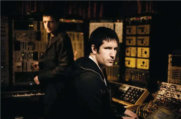  ?? (Courtesy of thefilmsta­ge.com) ?? TRENT REZNOR (right) and his latter-days NIN producer Atticus Ross first partnered with David Fincher on last year’s ‘The Social Network,’ which ultimately won the pair the Oscar for original score.