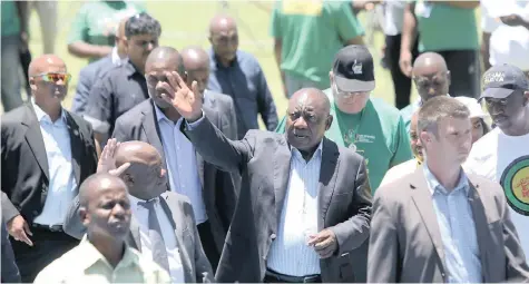  ?? MOTSHWARI MOFOKENG African News Agency (ANA) ?? PRESIDENT Cyril Ramaphosa and KZN acting premier Sihle Zikalala greet people at the official unveiling of the Harry Gwala Sports Facility yesterday as part of the ANC’s celebratio­n of its 107th anniversar­y and build-up to its manifesto launch. |