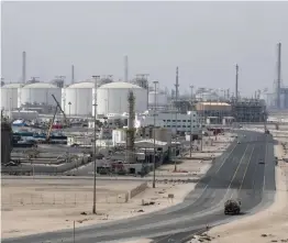  ??  ?? RAS LAFFAN, Qatar: A picture shows the Ras Laffan Industrial City, Qatar’s principal site for production of liquefied natural gas and gas-to-liquid, administra­ted by Qatar Petroleum, some 80 kilometers north of the capital Doha. — AFP