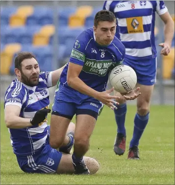  ??  ?? Blessingto­n’s Kevin John Rodgers tries to challenge AGB’s Cal Kelly during the SFC in Joule Park, Aughrim. Picture: Garry O’Neill
