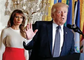  ??  ?? President Donald Trump speaks during an October event at the White House in Washington, as first lady Melania Trump listens. The two are scheduled to unveil his plan to combat opioid addiction Monday in New Hampshire.