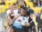  ??  ?? Ben Nakubuwai charges into New Zealand's Russell Packer and Adam Blair during Fiji’s upset 4-2 win against the Kiwis at the 2017 World Cup.