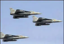  ?? AP ?? IAF’S Tejas jets during rehearsals ahead of Aero India 2021 at Yelahanka air base in Bengaluru on Tuesday.