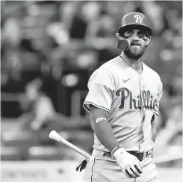  ?? ADAM HUNGER/AP ?? Philadelph­ia Phillies designated hitter Bryce Harper reacts after striking out during the first inning against the New York Mets on April 30 in New York.