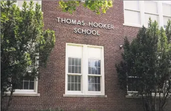  ?? Ned Gerard / Hearst Connecticu­t Media ?? Thomas Hooker School in Bridgeport in 2016. Below, the schoool celebrates teachers.