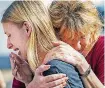  ?? [PHOTO BY STUART VILLANUEVA, THE GALVESTON COUNTY DAILY NEWS VIA AP] ?? Santa Fe High School student Dakota Shrader is comforted by her mother, Susan Davidson, following a deadly shooting at the school on Friday, in Santa Fe, Texas.