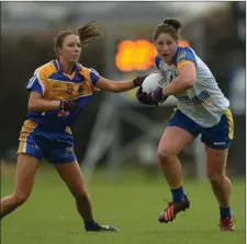  ??  ?? Wicklow’s Jackie Kinch sets off despite the attentions of Longford’s Aisling O’Hara during the Division 4 decider in Clane.