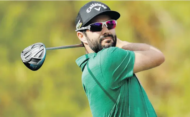  ?? — AP ?? Adam Hadwin had a three-shot lead heading into the final nine holes of the Desert Classic golf tournament in La Quinta, Calif., and made a 14-foot birdie on the final hole to win the tournament. He was second at the event in 2017, and this year marks his fourth straight top-six finish.