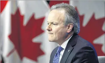  ?? AP PHOTO ?? Stephen Poloz, Governor of the Bank of Canada, holds a press conference at the Bank of Canada in Ottawa on Wednesday. Bankruptci­es are up in Canada, the head of the Bank of Canada said this week, and he expects they’ll rise even more as the central bank continues to hike interest rates.