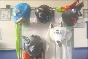  ?? Jesse Miller ?? Masks created by students under the direction of Peñasco’s new art teacher Alessandra Ogren were used in a theater play during the final weeks of school. Ogren started in April and is gearing up for more projects for the 2018-19 school year.
