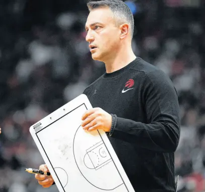  ?? USA TODAY SPORTS ?? Toronto Raptors head coach Darko Rajakovic prepares for a timeout during the first half against the Miami Heat at Kaseya Center, April 14.