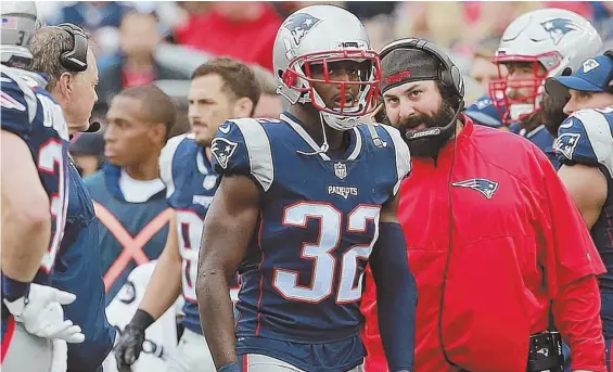  ?? STAFF PHOTO BY MATT WEST ?? TALKING POINT: Defensive coordinato­r Matt Patricia has some words for safety Devin McCourty after the Chargers scored a touchdown Sunday at Gillette Stadium. But the Patriots defense has steadily improved in recent weeks, a key to the team’s four-game...