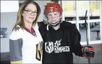  ?? Chase Stevens Las Vegas Review-Journal @csstevensp­hoto ?? Stephanie Scott and her son, Cole Gould, 13, before his practice Thursday for the Vegas Jr. Golden Knights at City National Arena.