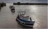  ?? ?? French trawlers arrive in the port of Granville, Normandy, after   shing.