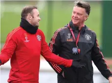  ?? GETTY IMAGES ?? Give us a break, boss: Rooney chats with Van Gaal