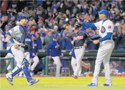  ?? CHARLES REX ARBOGAST/ASSOCIATED PRESS ?? Aroldis Chapman got eight outs in the longest relief appearance of his career and the Chicago Cubs held off Cleveland, 3-2, on Sunday night, cutting the Indians’ lead in the World Series to 3-2.
The Cubs won a Series game at Wrigley Field for the...