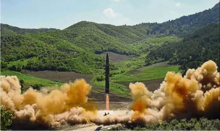  ??  ?? Rocket arsenal: A photo from the North Korean government showing what is said to be the launch of a Hwasong-14 ICBM at an undisclose­d location. — AP