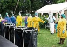  ?? — AFP ?? Zimbabwe health workers getting ready for their vaccinatio­n programme after receiving a donation of 200,000 doses of the Sinopharm Covid-19 vaccine from China.