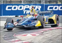  ?? [ANDREW LAHODYNSKY­J/THE CANADIAN PRESS] ?? Alexander Rossi darts around a corner during Saturday’s qualifying at the Honda Indy in Toronto.