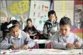  ?? PICTURE: REUTERS ?? Bedouin Palestinia­n schoolchil­dren play during a class at their school in al-Khan al-Ahmar village near the West Bank city of Jericho on Thursday.