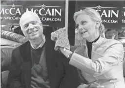  ?? CHARLES DHARAPAK/AP ?? John and Cindy McCain share a laugh on the campaign trail in 2008. McCain’s “Straight Talk Express” campaign bus became an icon of his two runs for the presidency.