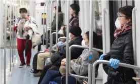  ??  ?? Commuters wearing face masks on the undergroun­d in Barcelona. Photograph: Marta Perez/EPA