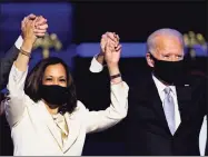  ?? Andrew Harnik / Associated Press ?? Experts said the mask mandates, increased testing and other COVID-19-fighting measures planned by President-elect Joe Biden and Vice President-elect Kamala Harris will still make a difference here.