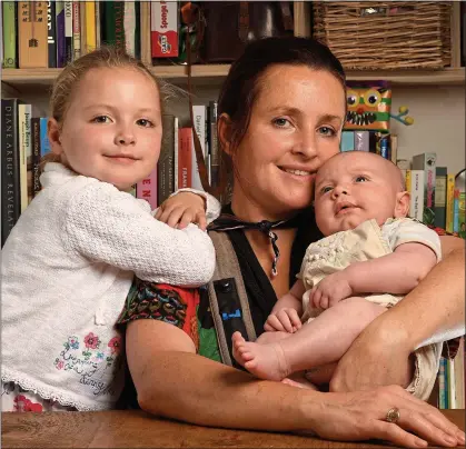  ??  ?? CONCERNS: Sarah Newton, with Isabelle and four-week-old Joshua, was initially declined the state maternity allowance