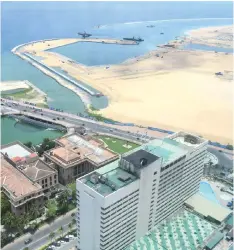  ?? – AFP photo ?? A general view of the constructi­on site of the Chinese-funded land reclamatio­n project for Port City next to Colombo. When it is completed, Port City will effectivel­y double Colombo’s size and be part of a glimmering troika of new, Chinese-funded islands alongside a man-made archipelag­o off Malaysia and a planned futuristic metropolis adjoining Manila.