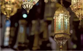  ?? GETTY IMAGES ?? Visual Question:
By what name is the traditiona­l lantern used during Ramzan called? These are bright, colourful hanging lamps that are used to decorate homes and streets during Ramzan.