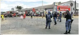  ?? Picture: Mandla Khoza ?? Piet Retief, above, came to a standstill when the five men accused of murdering Mgcini and Zenzele Coka at Pampoenskr­aal farm appeared in the town’s magistrate’s court before being released on bail late last month, left.