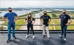  ?? COURTESY OF SPACEX ?? Jared Isaacman (left), commander of the private Spacex spacecraft, joins his crewmates (from left) Hayley Arceneaux, Sian Proctor and Chris Sembroski for a photo Monday from the Spacex launch tower at NASA’S Kennedy Space Center at Cape Canaveral, Florida.